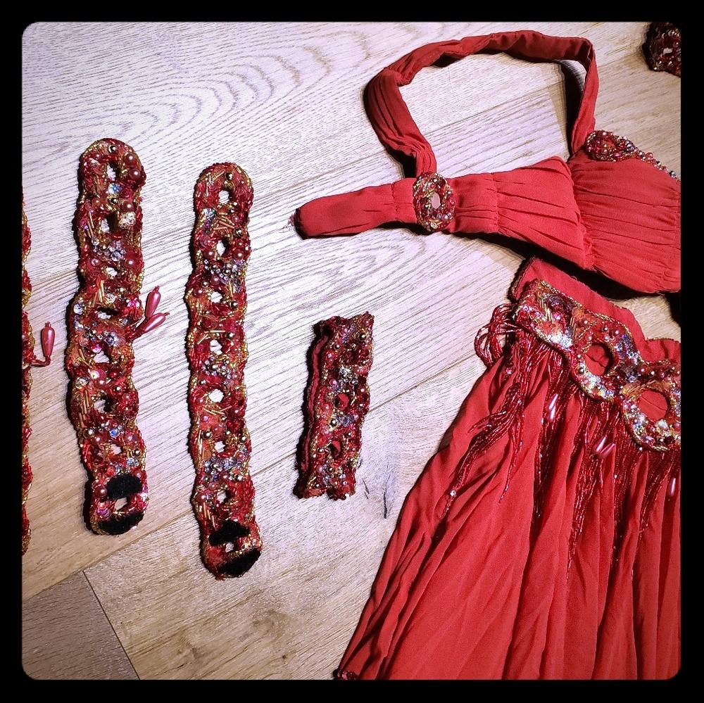 Red belly dance costume with rings.